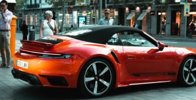 a red sports car parked on the side of the road